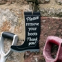 Picture of Please remove you boots sign